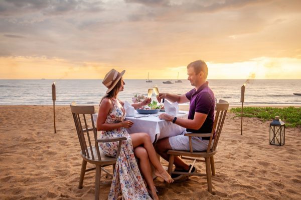 couple having dinner on the beach