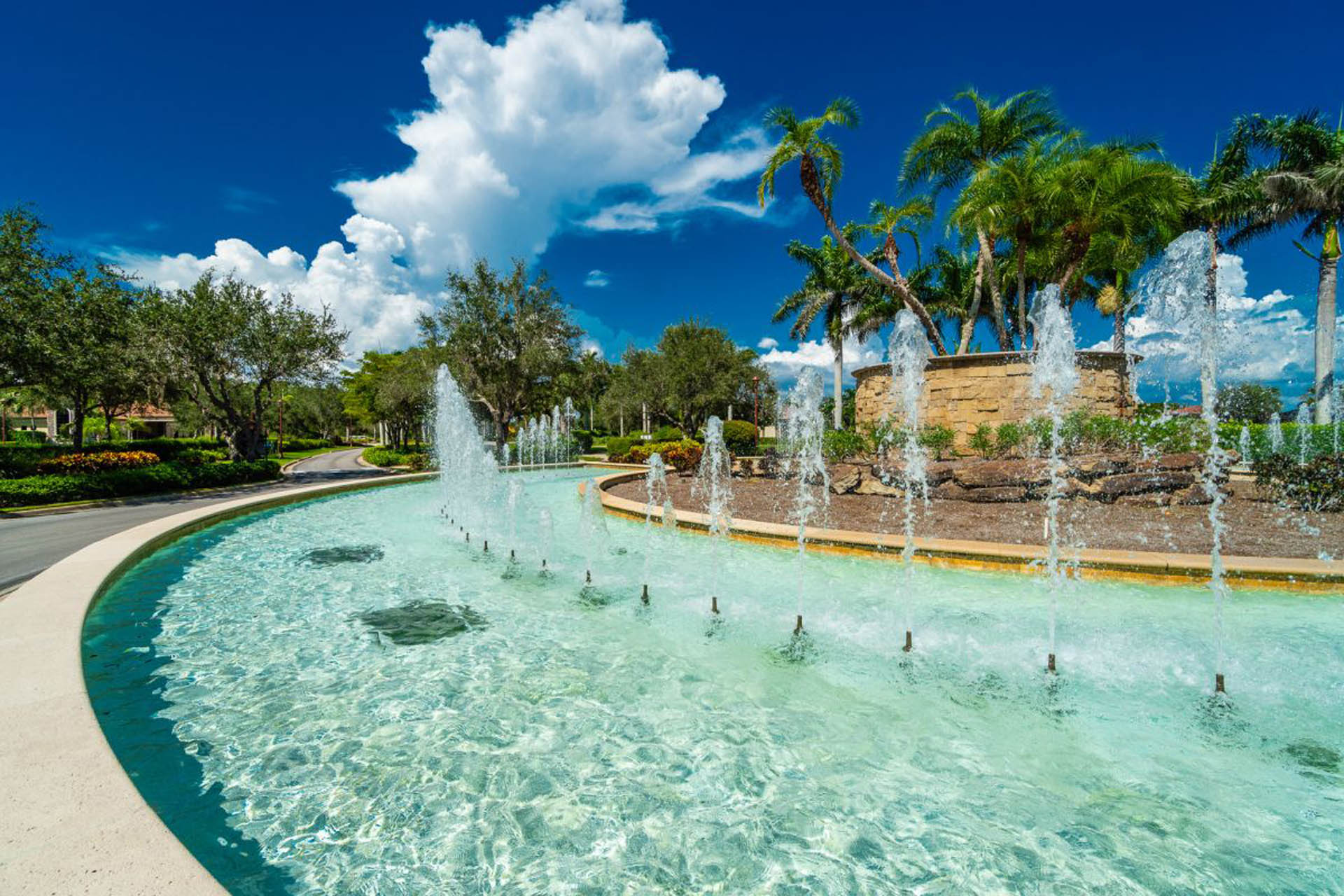 Fountain with trees at Treviso Bay - Treviso Bay Vacation Rentals in Naples Florida