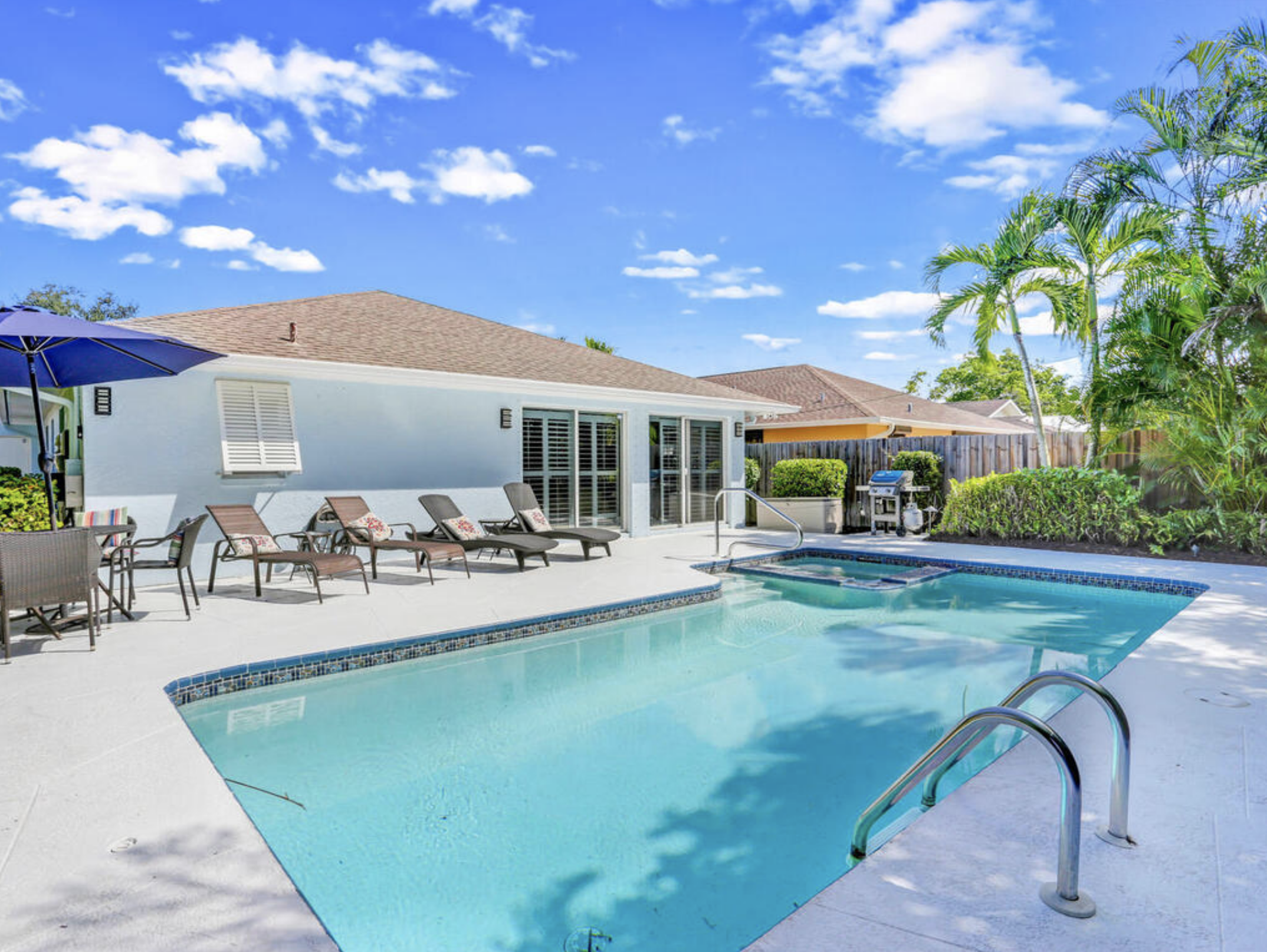 Backyard pool area at Naples Park 640 Rental